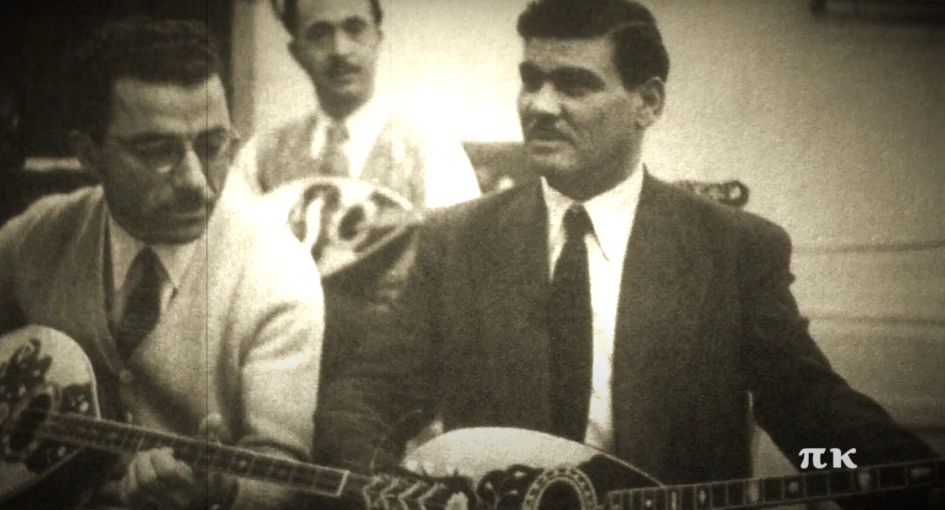 Three musicians playing stringed instruments.